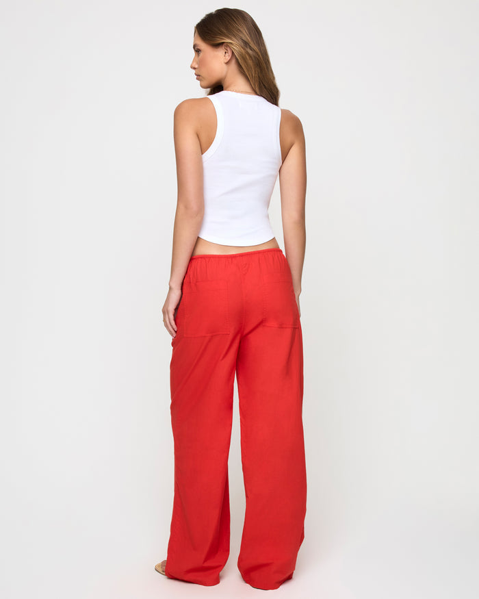 Back view of a model wearing the LSPACE Ash Tank in lover, showing the racerback design.