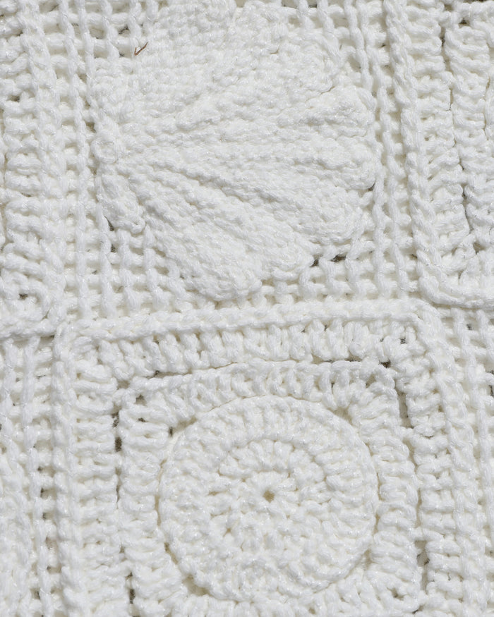 Close-up of the LSPACE Calla Dress in cream, showing the textured crochet granny-square fabric detail with circular raised motifs.