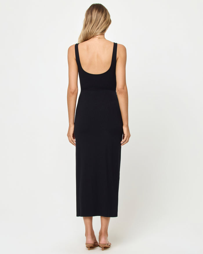 Back view of a model wearing the LSPACE Camille Dress in black, showing the open scoop back.