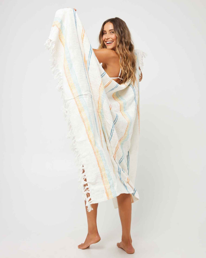 LSPACE Kimana beach blanket, lifestyle/editorial view on model.