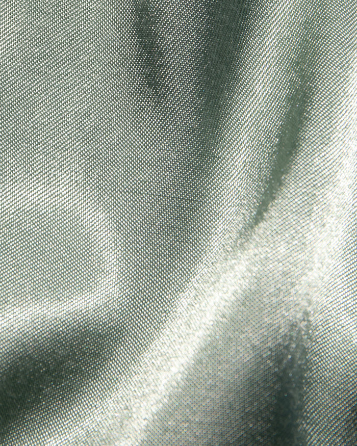 Close-up of the LSPACE Las Palmas Dress in celadon, highlighting the lustrous celadon satin fabric texture.