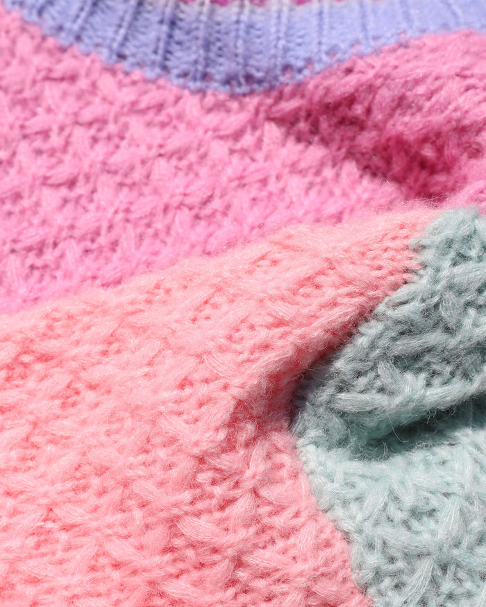 Close-up of the LSPACE Pretty Please Sweater in costa del sol colorblock, showing the chunky knit texture with pink, light pink, and mint green colorblock sections meeting at the seams.