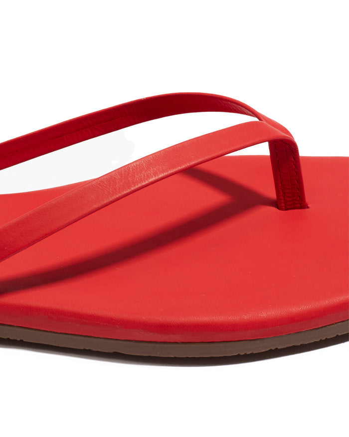 Close-up of the TKEES Square Toe Lily Sandals in red showing the strap and footbed detail.