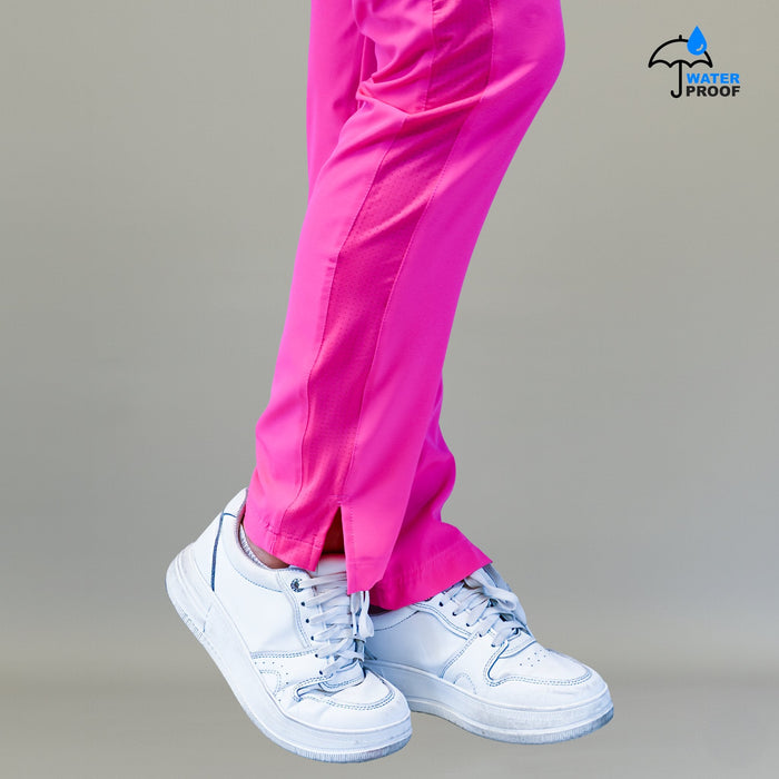 Women's Style 530 Fuchsia scrub pants, side-slit hem detail above a white sneaker