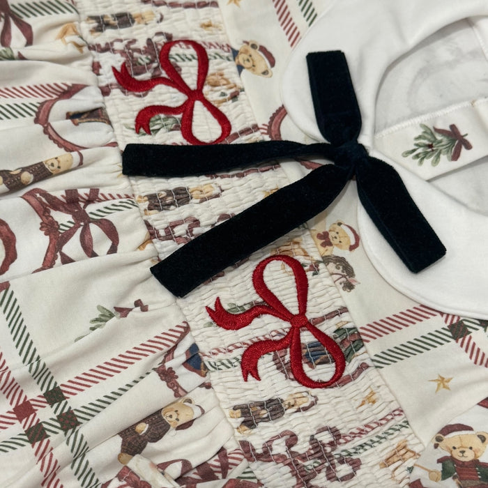 Close-up of rounded white collar, black velvet bow and Festive Bears holiday print