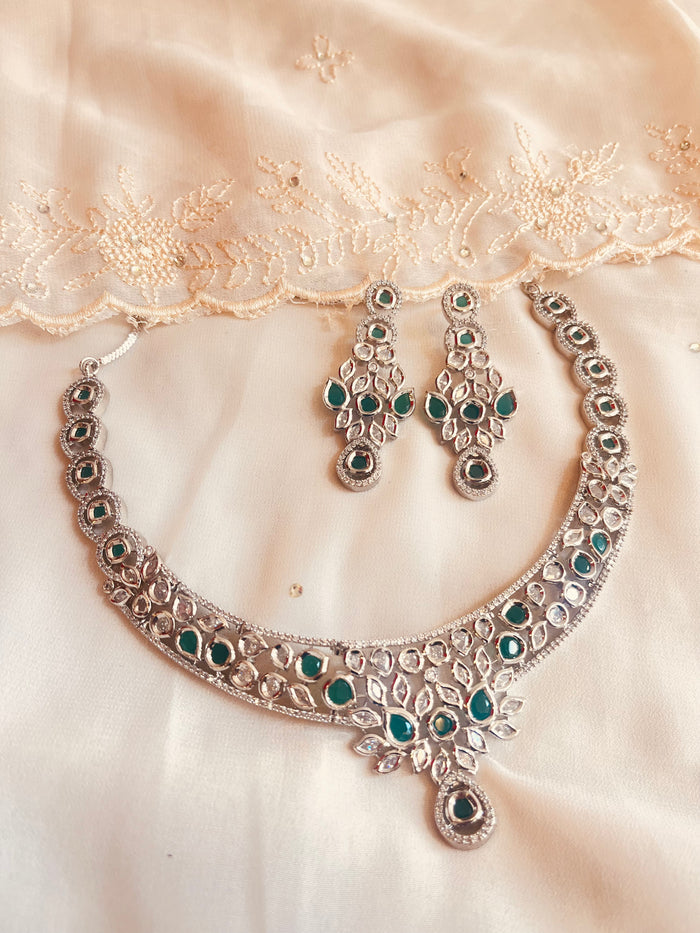 MOHAR Kundan-style choker set in emerald-tone stones with silver-finish base