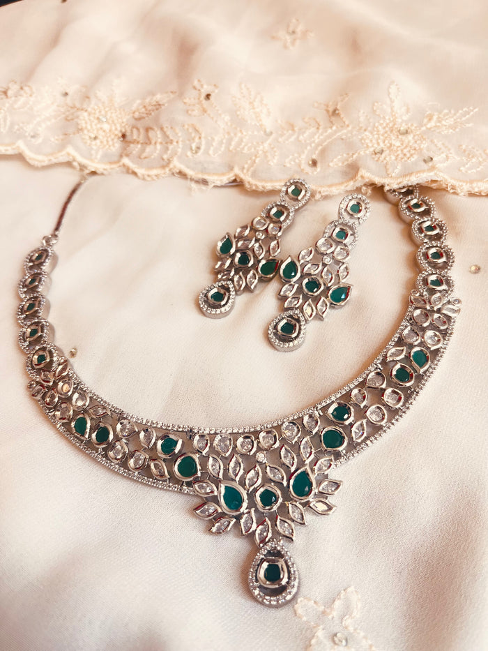 MOHAR Kundan-style choker set in emerald-tone stones with silver-finish base