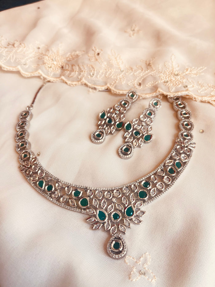 MOHAR Kundan-style choker set in emerald-tone stones with silver-finish base