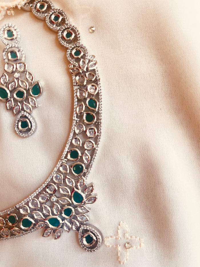 MOHAR Kundan-style choker set in emerald-tone stones with silver-finish base