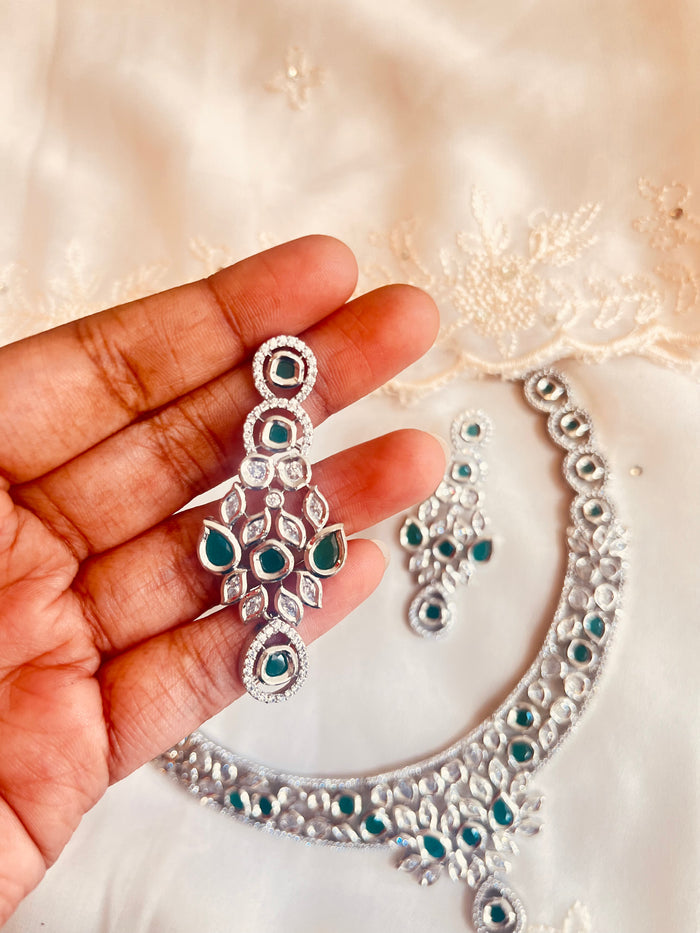 MOHAR Kundan-style choker set in emerald-tone stones with silver-finish base