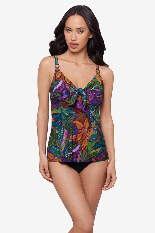Woman wearing a jungle print tankini top with O ring straps