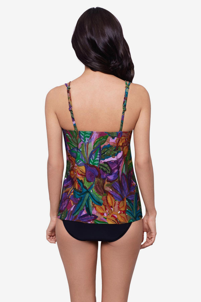 Woman turned away wearing a jungle print tankini top with O ring straps