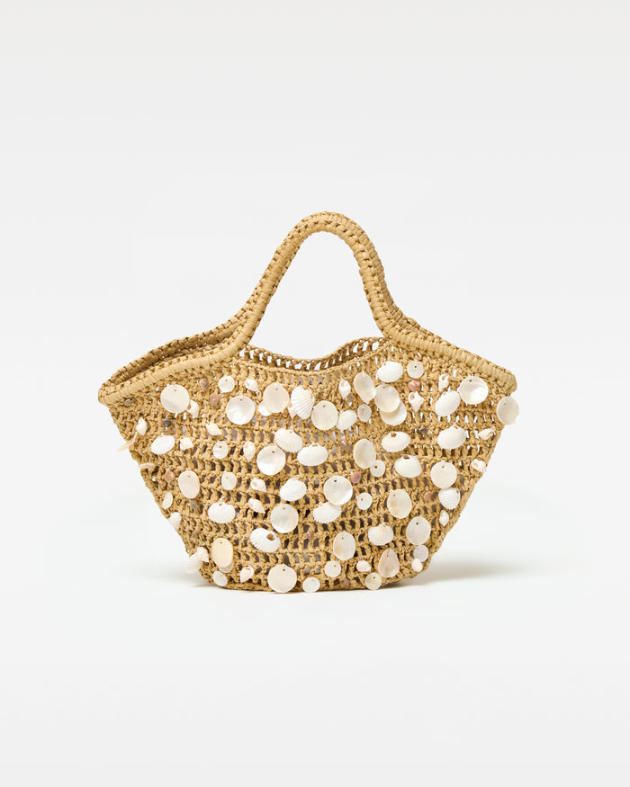 Off-model front view of the cream and natural Alba Bag, a woven tote with shell embellishments.