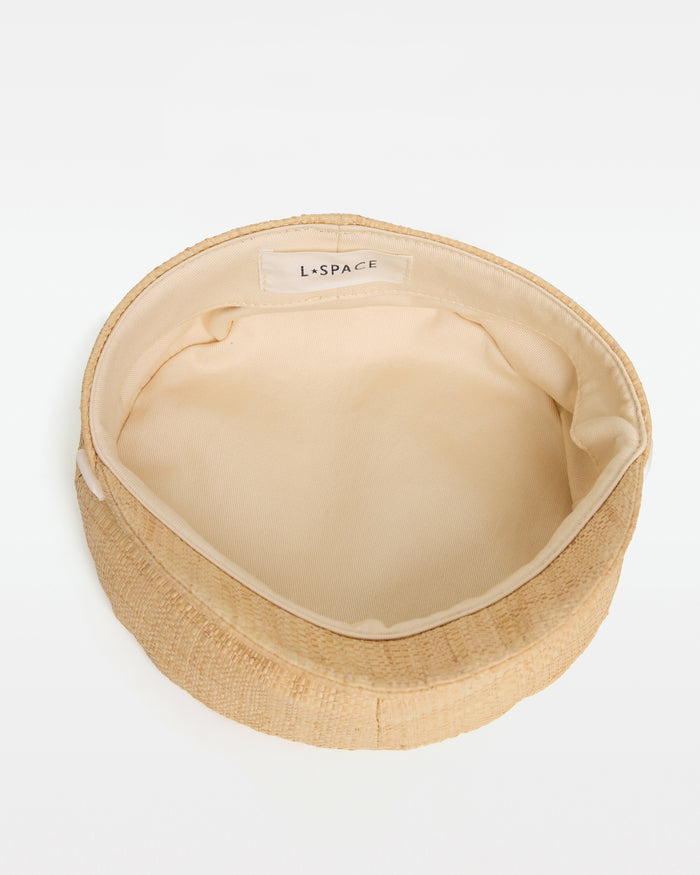 Top-down interior view of the Alfama Cap in natural showing the cream lining and LSPACE branding label.