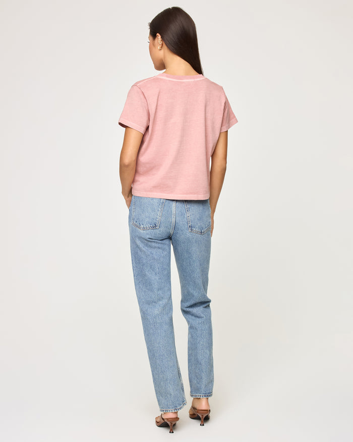Back view of a model wearing the LSPACE All Day Top in pink clay, showing the relaxed cropped silhouette and crew neckline.