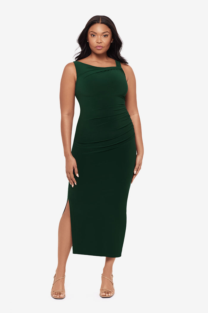 Woman wearing a dark green maxi dress with slits on both sides