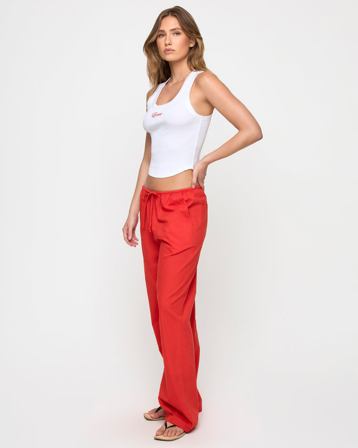 Side view of a model wearing the LSPACE Ash Tank in lover, showing the cropped silhouette and ribbed texture.