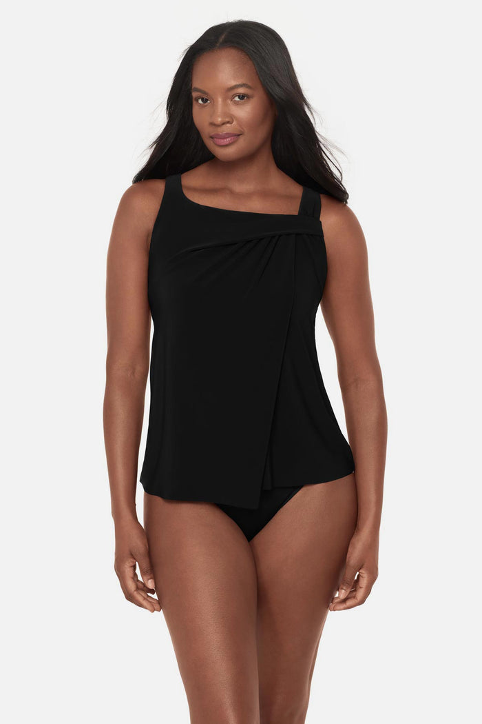 Woman wearing a black tankini top