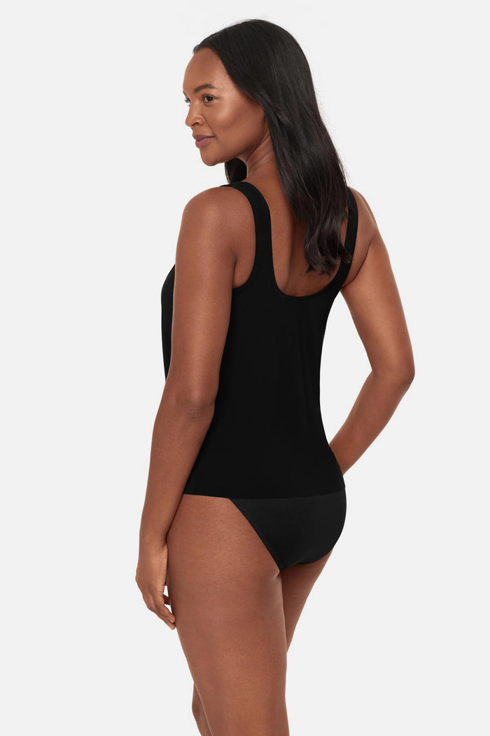 Woman turned left wearing a black tankini top