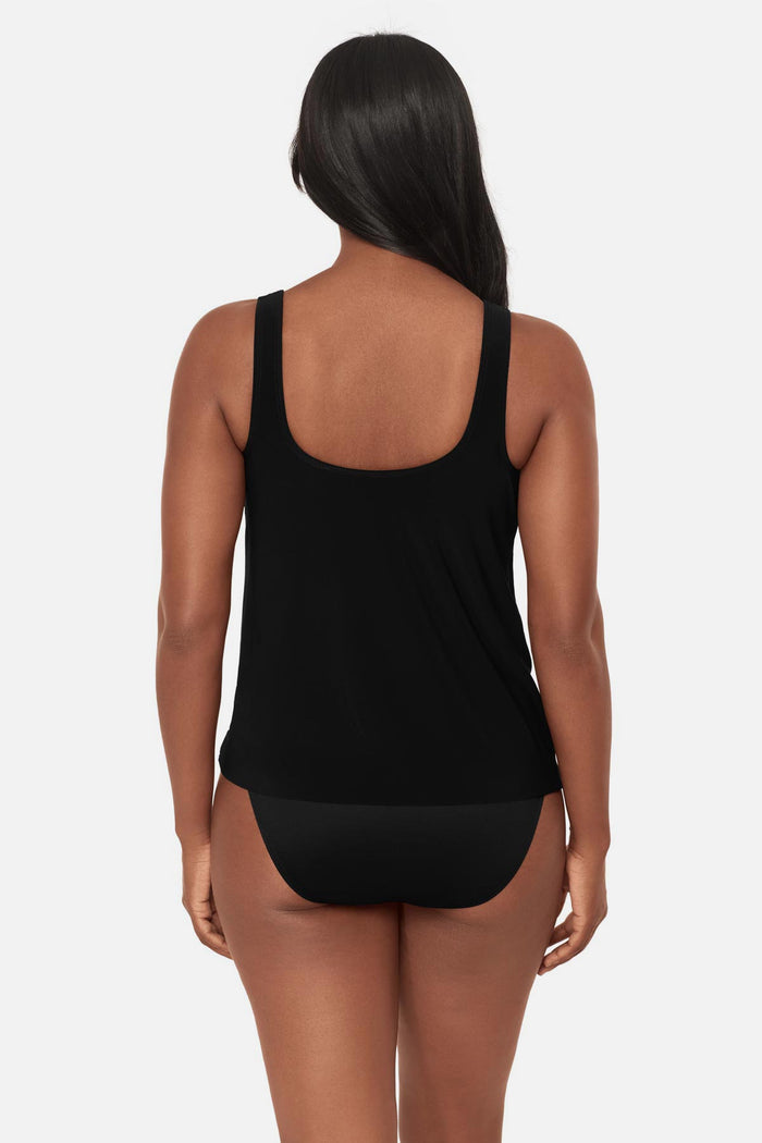 Woman turned away wearing a black tankini top