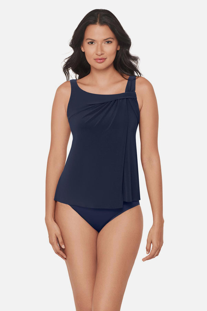 Woman wearing a navy blue tankini top