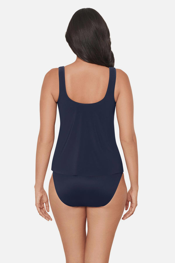 Woman wearing a navy blue tankini top