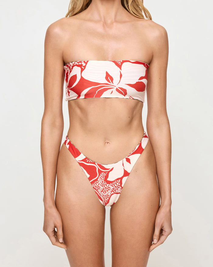Close-up front view of a model wearing the LSPACE animal hibiscus bloom Avalon Bikini Top with a matching animal hibiscus bloom Damian Bikini Bottom, styled with the hibiscus bloom print.