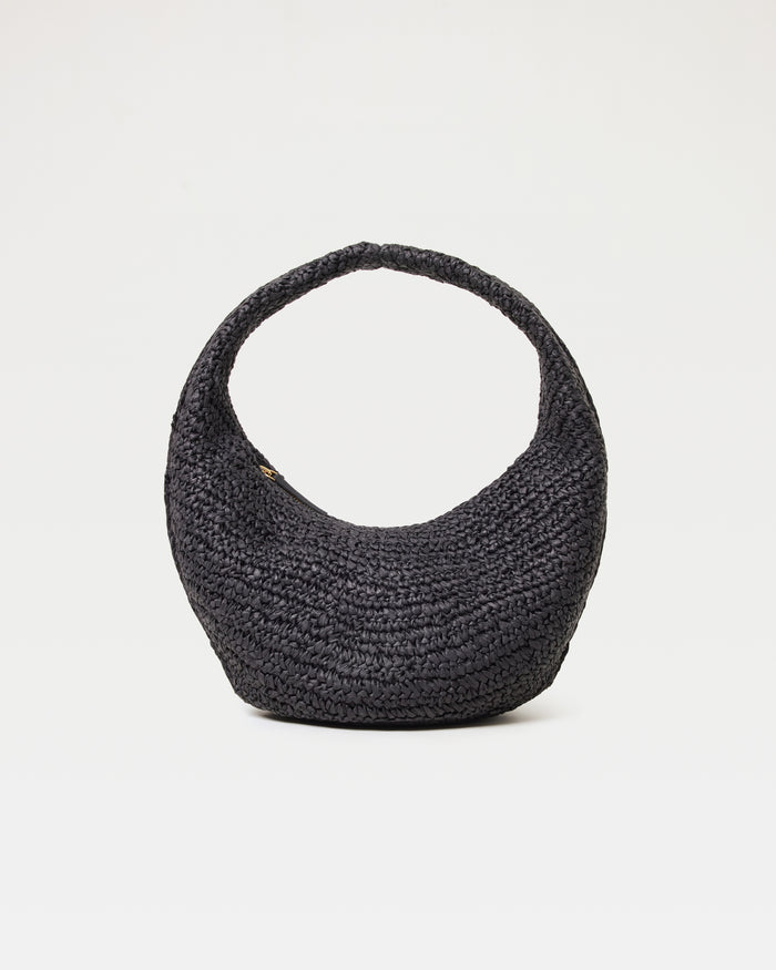 Off-model front view of the Aya Bag in black, a crescent-shaped woven raffia hobo bag with a curved top handle, on a white background.
