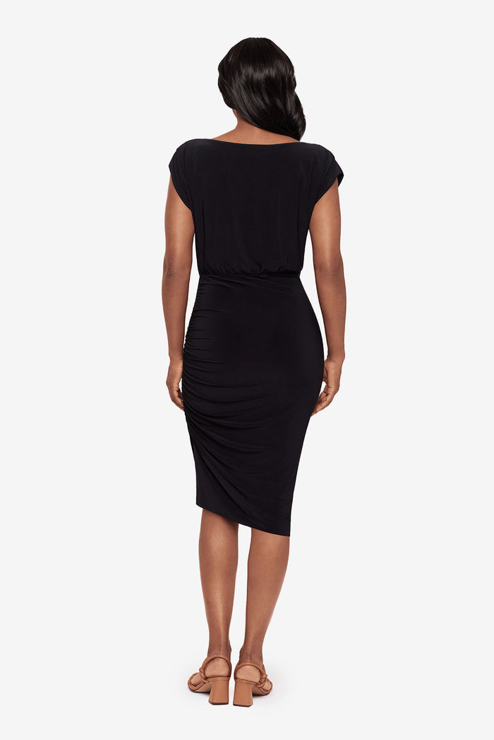 Woman faced away wearing a black dress