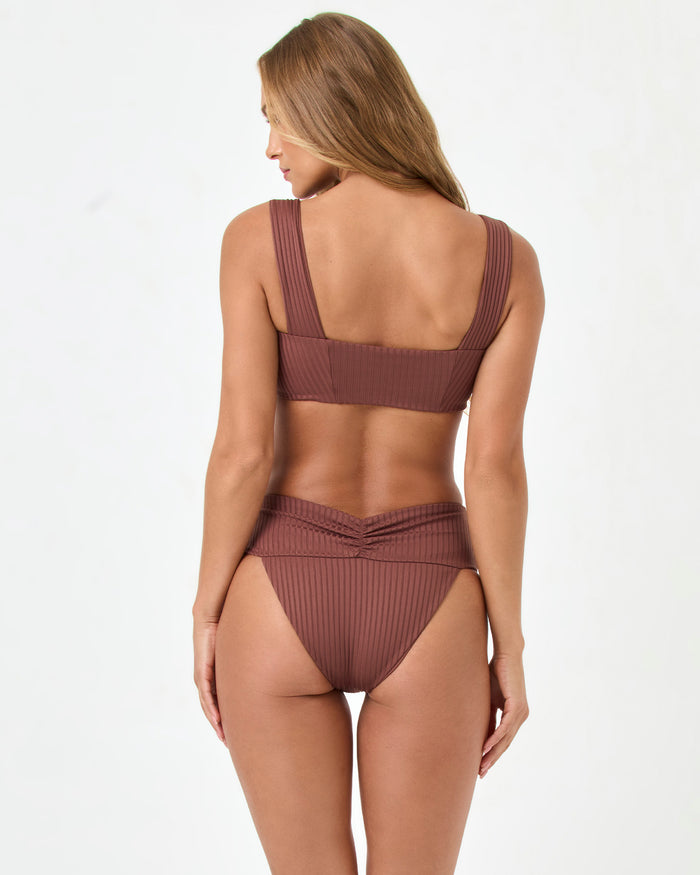 Back view of a model wearing the LSPACE cafe Bardot Bikini Bottom with a matching ribbed Marlee Bikini Top.
