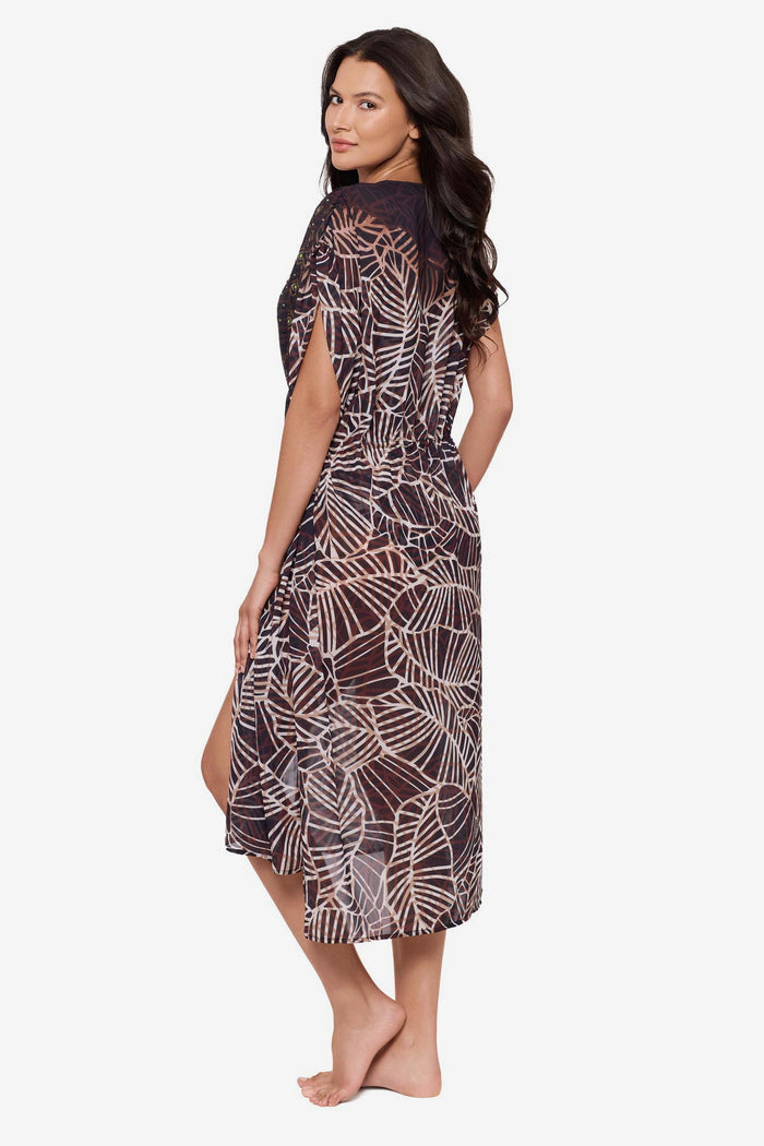 Woman turned left wearing a brown printed kimono swim cover up