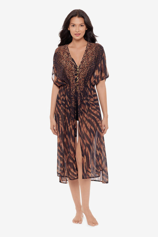 Woman wearing a black and brown beaded kimono style swim cover up