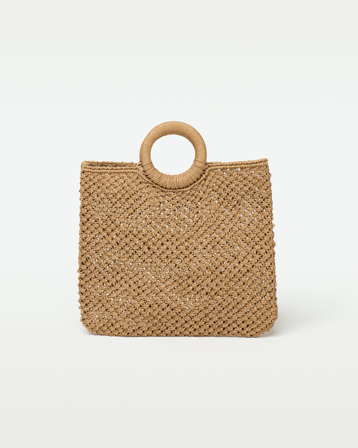 Front view of the Bella Tote in natural, showing a woven crochet raffia-style tote with an open diamond lattice weave and a single raffia-wrapped round ring handle.