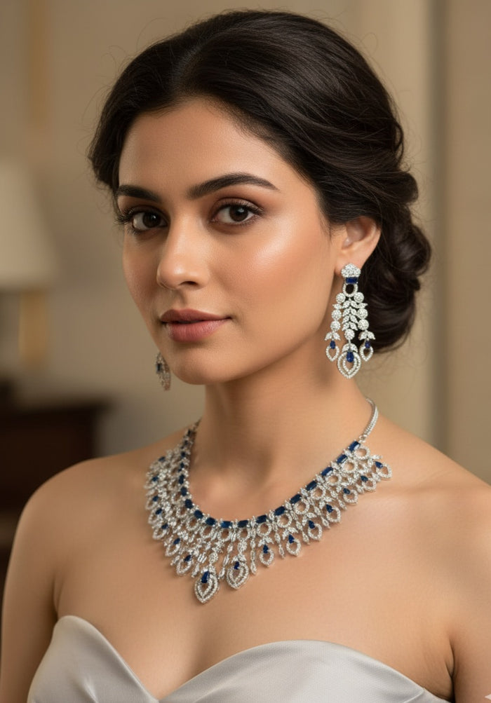MOHAR statement necklace set in blue cubic zirconia stones with clear accents