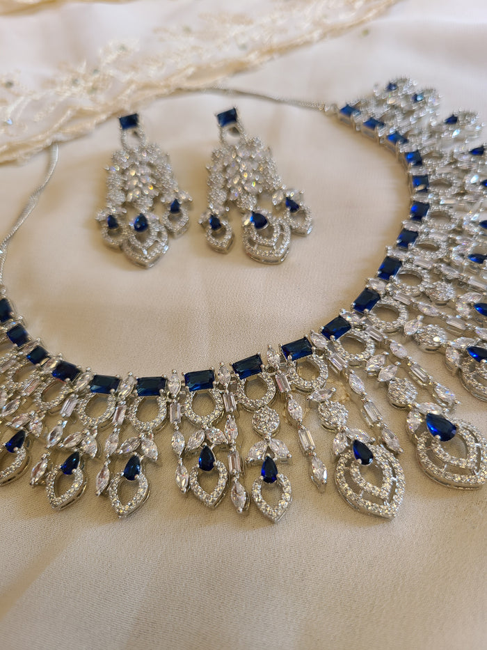 MOHAR statement necklace set in blue cubic zirconia stones with clear accents