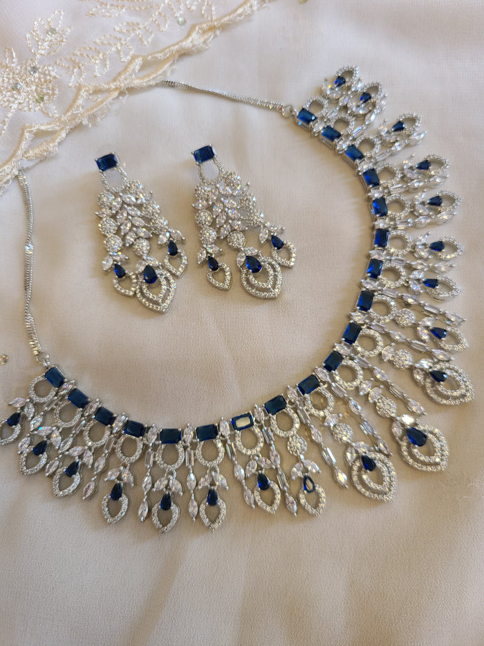 MOHAR statement necklace set in blue cubic zirconia stones with clear accents