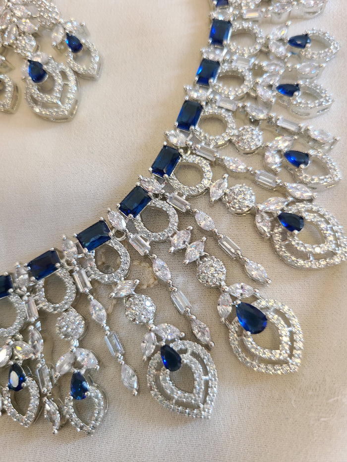 MOHAR statement necklace set in blue cubic zirconia stones with clear accents