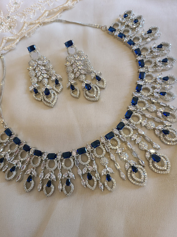 MOHAR statement necklace set in blue cubic zirconia stones with clear accents