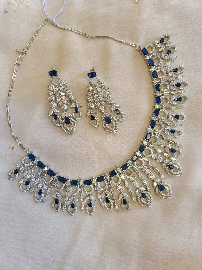 MOHAR statement necklace set in blue cubic zirconia stones with clear accents
