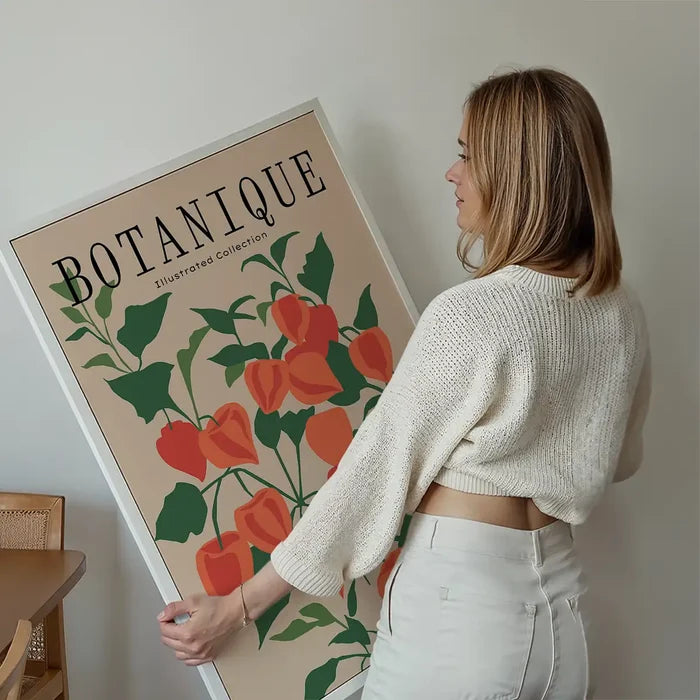 Botanique Illustrated Floral Print held up against a living room wall