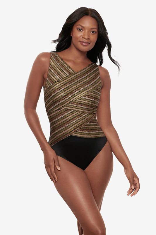Woman wearing a shimmery golden brown high neck one-piece swimsuit