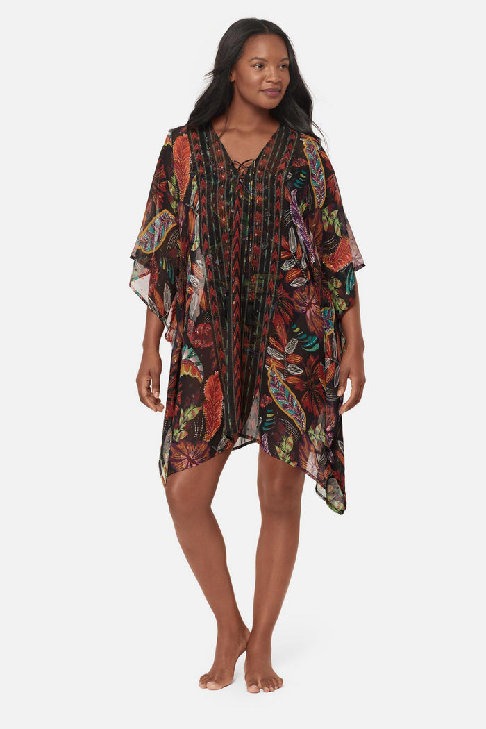Woman wearing a multicolored floral printed caftan swim cover up
