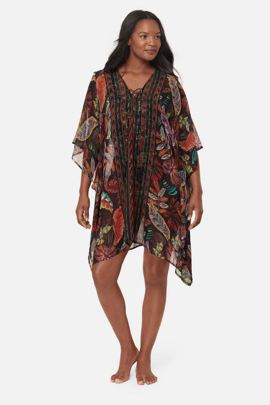 Woman wearing a multicolored floral printed caftan swim cover up