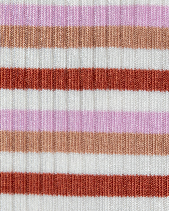 Close-up of the LSPACE Callie Halter in azalea stripe, showing the ribbed fabric texture in pink, white, tan, and rust horizontal stripes.