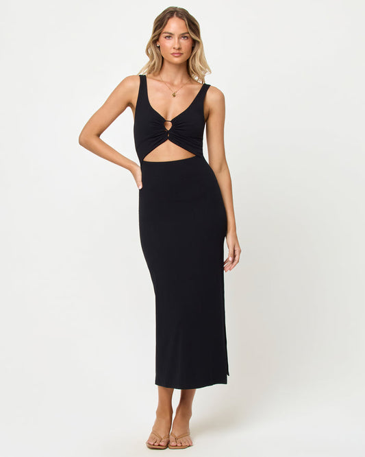 Front view of a model wearing the LSPACE Camille Dress in black, featuring a plunging V-neckline, cutout waist with ring detail, and side slit.
