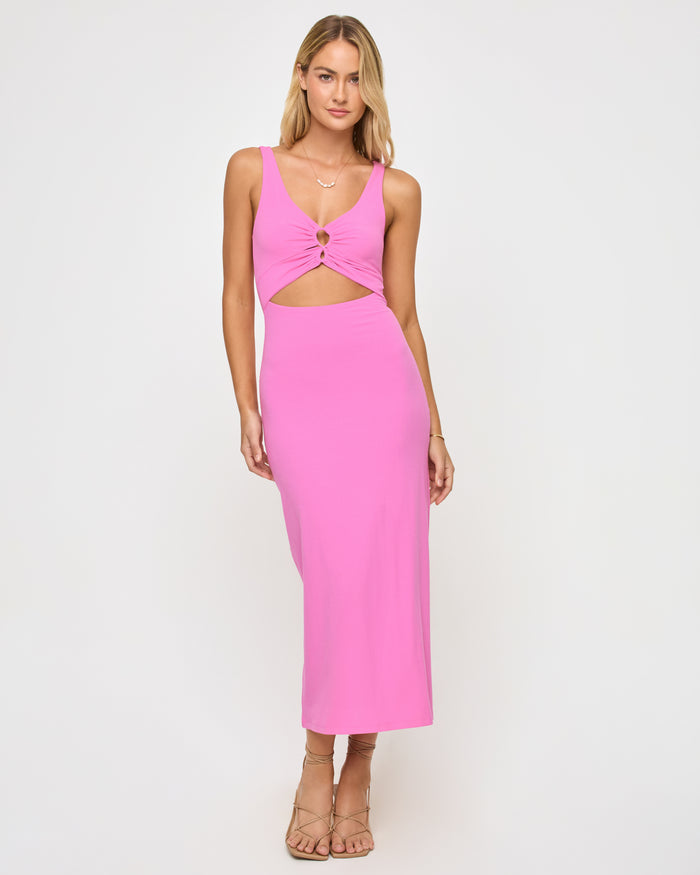 Front view of a model wearing the LSPACE Camille Dress in hottest pink, a bright pink midi dress with thick tank straps, front twist-knot ring detail, cutout below the neckline, and side cutouts at the waist.