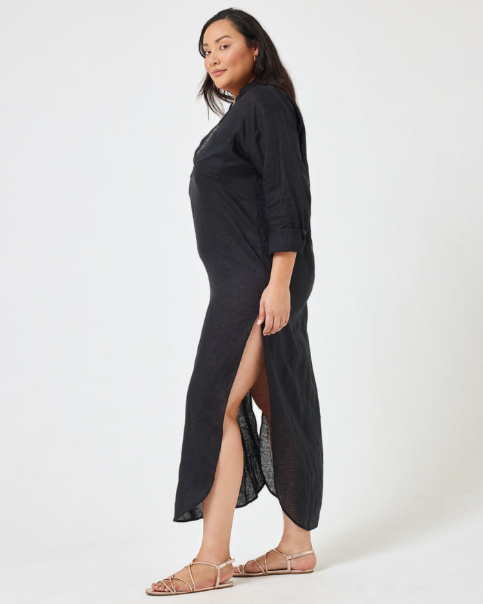 Side view of a model wearing the LSPACE Capistrano Tunic in black linen.
