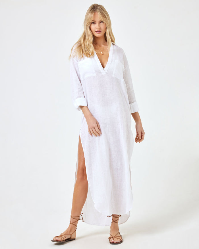 Front view of a model wearing the LSPACE Capistrano Tunic in white, a linen maxi with a collared V-neck and 3/4 sleeves.
