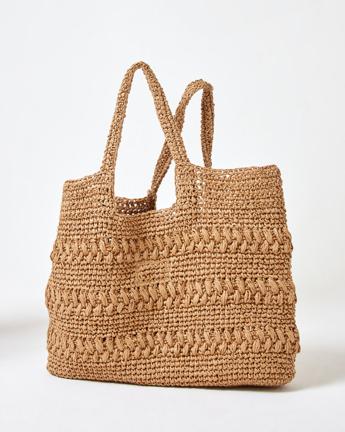 Back view of the Changing Tides Bag in natural showing the crochet woven texture and two handles.
