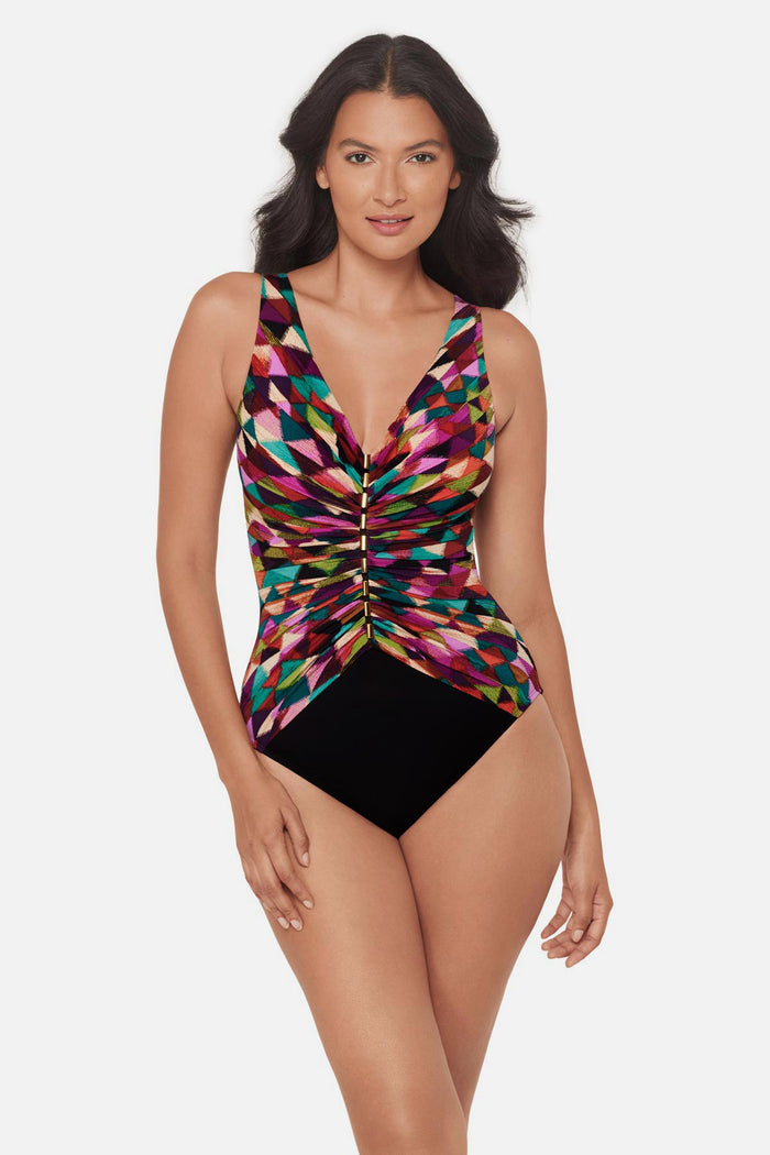 Woman wearing a multicolored geometric printed V neck one-piece swimsuit